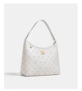 White PU leather shoulder bag with cute cat and bow monogram pattern and metal logo plaque.