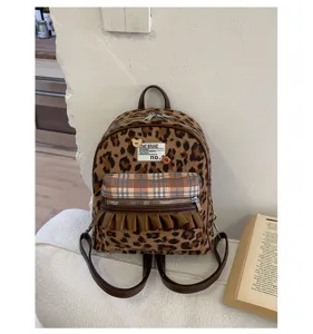 Retro leopard print flannel mini backpack with plaid front pocket and cute bear decor.