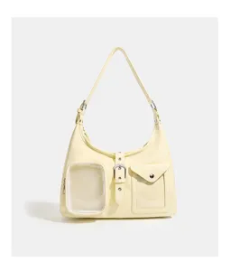 Light yellow PU leather itabag shoulder bag with clear window and crossbody strap for women.