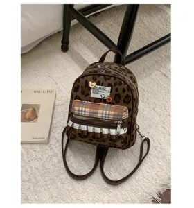 Details of vintage leopard print mini backpack with plaid pocket and cute ruffles for women.