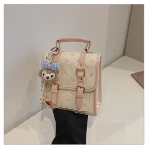 Preppy style pink and white mini backpack handbag with cute cat prints and plush pendant.