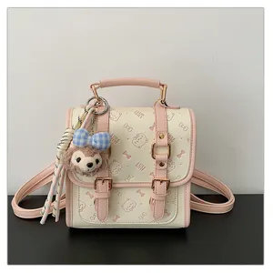 Luxe Kitty sweet college style backpack cute pink and cream school bag with plush charm.