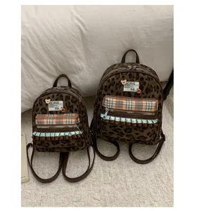 Flannel leopard print mini backpack for girls, retro student school bag with plaid pocket.