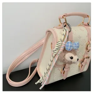 College style women's PU leather handbag with cute bear pendant, pink trim and satchel design.
