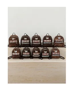 Detailed view of vintage velvet leopard print mini backpack with cute plaid front pocket design.