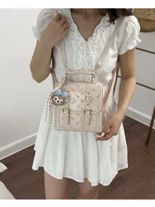 Mini beige leather backpack with cute debossed patterns, double buckles, and stylish design.