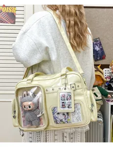 Detail view of Japanese transparent ita bag with clear window, anime plush and cards display.