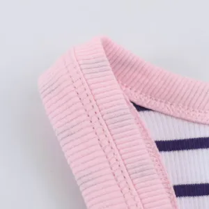 Close-up view of pink ribbed neckline and blue stripe knit fabric, clean stitching detail.