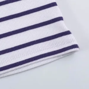 Detail view of purple and white striped ribbed knit fabric showing texture and stitching