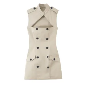 Beige sleeveless double-breasted dress detail showcasing front cutout, lapel, and dark buttons.