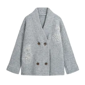 Grey double breasted knit cardigan featuring pearl bead embroidery and V neck detail.
