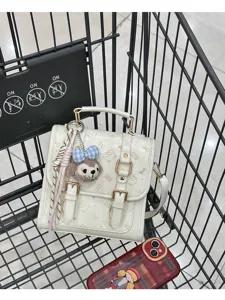 LUXE&KITTY retro PU leather satchel bag with cute bear plush charm and stylish printed design.