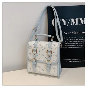 Light blue college style women backpack with cute cat bow print, casual commuter handbag.