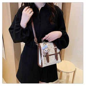 Detailed view of college style women backpack handbag with cute print and brown leather straps.