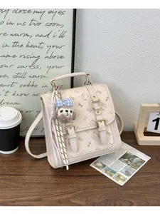 Detail view of the beige PU leather vintage backpack with cute cat prints and chic design.