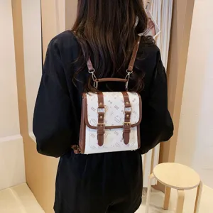 Preppy style women's small backpack with cute cat print, brown PU leather and dual buckle.