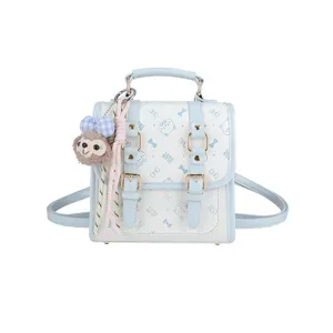 Chic preppy style blue and white mini backpack with cute plush pendant and cat print.