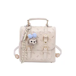 Chic beige vintage mini backpack with cute plush charm, bows, and embossed cat pattern.