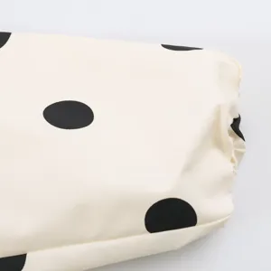 Fashion women's polka dot print pilot jacket detail shot, stylish casual outerwear.