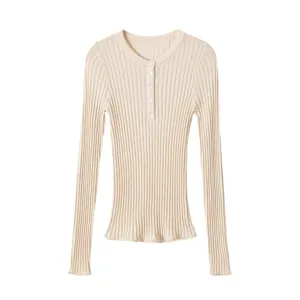 Ribbed knit top detail showing long sleeves, crewneck and button front design features.