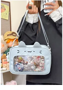 Cute light blue cat ear ita bag with clear window for anime pins and daily fashion use.