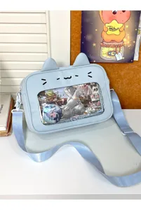 Detailed view of cute cat ear ita bag with clear window, light blue cross-body design.