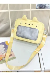 Close-up detail of cute yellow cat ear ita bag with clear window, perfect for pins and daily wear.
