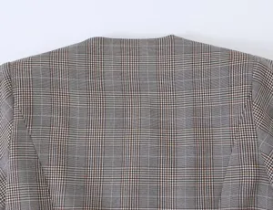 Close-up detail view of the back collar and shoulder on a women's plaid blazer jacket.
