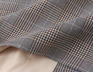 Detailed shot of women casual plaid blazer fabric texture and lining, professional closeup.
