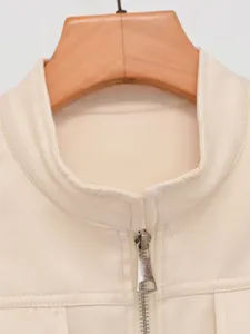 Beige stand collar zipper jacket vest detail closeup showcasing premium texture and stylish design.