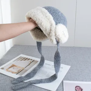 Winter plush earflap knitted hat with thick fleece lining, cozy warm ushanka cap for women.
