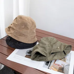 Retro pleated suede bucket hat detail view, soft fabric texture and versatile autumn style.