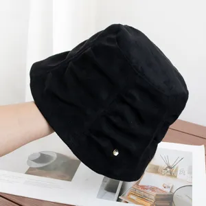 Detailed view of the black retro pleated suede bucket hat, showcasing soft texture and artistic style.