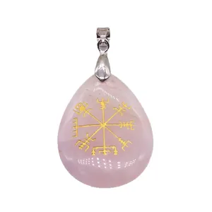 Natural rose quartz teardrop pendant with gold Viking rune engraving and silver bail.