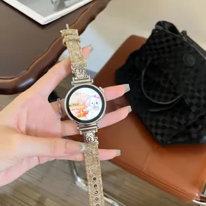 Detail view of denim fabric smartwatch strap with cute metal bear charms for daily wear.