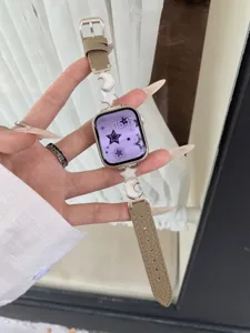 Luxury leather watch band with star and moon charms compatible with Apple Watch, stylish accessory.