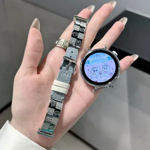 Stylish denim and metal watch strap with cute animal design, compatible with smartwatches.