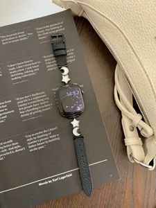 Luxury star moon leather strap for Apple Watch, stylish black band for iWatch series.