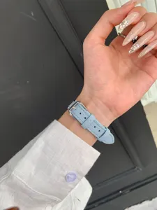 Light blue litchi grain leather watch strap replacement compatible with Apple Watch Series.