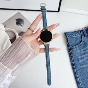 Denim smartwatch strap detail view with rose gold connectors and stylish classic design.