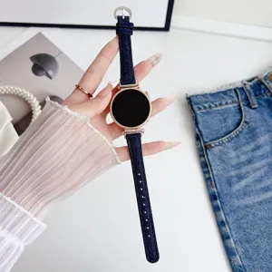 Denim watch band with rose gold case, stylish replacement strap for smart watches detail.
