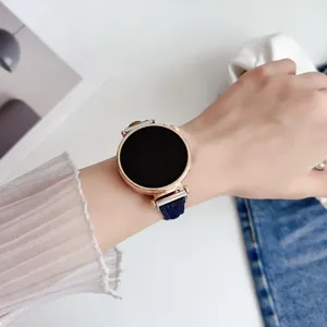 Denim smartwatch strap replacement detail, stylish blue fabric band for women's smart watch.