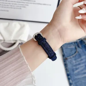 Slim denim watch strap detail view, stylish replacement band compatible with various smartwatches.