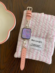Star and moon leather watch strap compatible with Apple Watch, stylish pink accessory band.