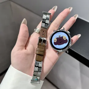 Metal and leather smart watch strap featuring a cute puppy cartoon design, detail view.