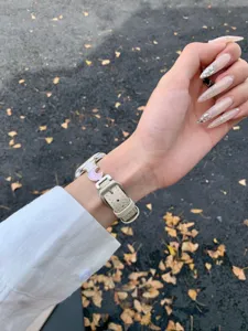 Star moon leather watch band detail, compatible with Apple Watch, stylish wrist accessory.