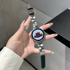 Close-up of the cute puppy smartwatch denim and metal strap, stylish and creative.