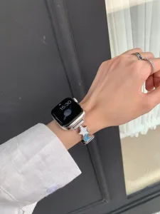 Star and moon charm watch strap replacement compatible with Apple Watch series, stylish accessory.