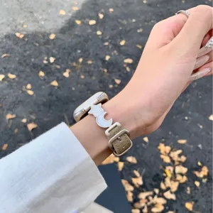Litchi pattern leather Apple Watch strap with star and moon charms, stylish and elegant.