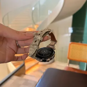 Denim fabric smart watch replacement strap detail with metallic eyelets and cute bear buckle.